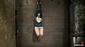 A hot MILF hooked with a crotch rope and flogged