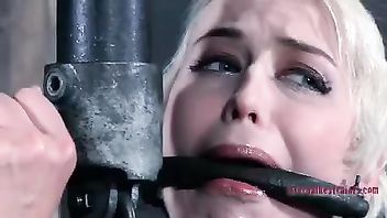 A short-haired beauty is bound and teased until she squirts and cries
